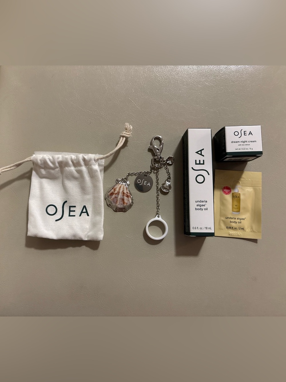 Osea travel set body oil, night cream w/ charm